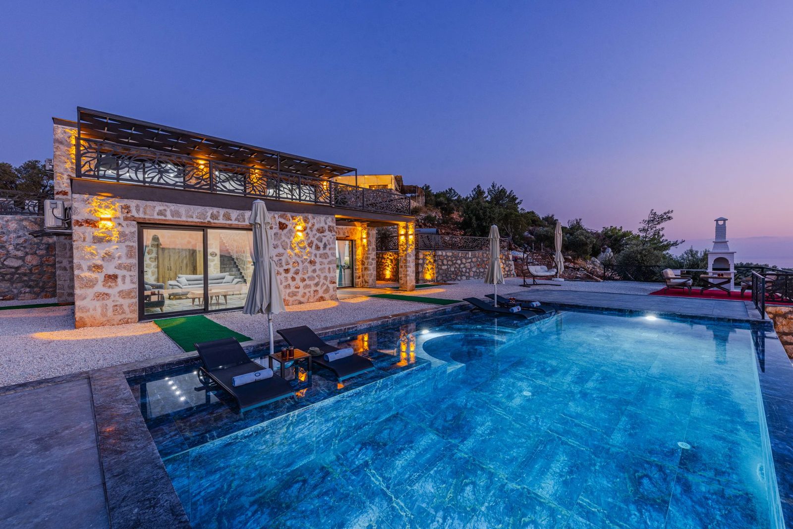 Evening lighting reflecting across a long pool โ design inspiration